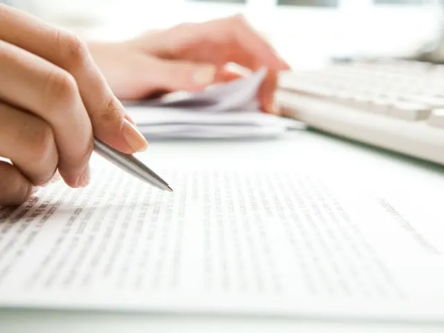 Close-up of secretary?s hands doing paperworkPhoto taken on: Ma